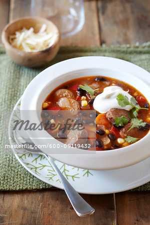 Black bean and sausage soup topped with sour cream