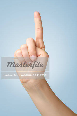 Female index finger with an adhesive bandage