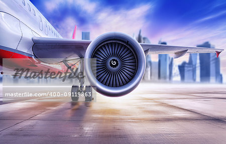 airplane in front of a big city skyline