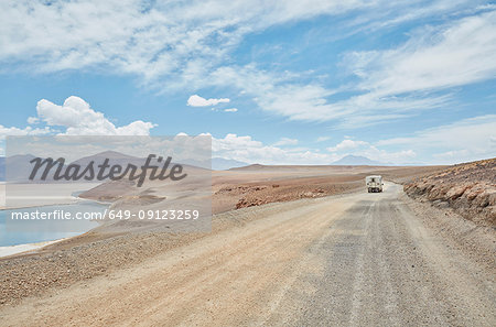 Recreational vehicle on empty road, Chiguana, Potosi, Bolivia, South America