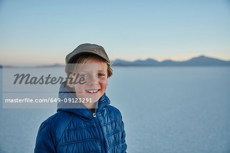 Portrait of boy on salt flats, Salar de Uyuni, Uyuni, Oruro, Bolivia, South America