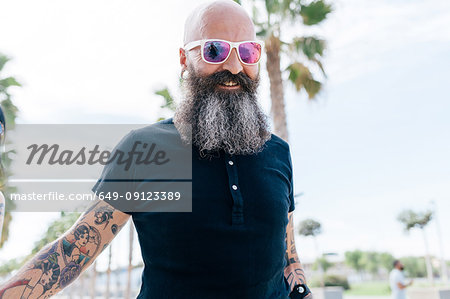 Portrait of mature male hipster in sunglasses