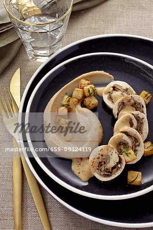 Chicken roulade filled with mushrooms served with chestnut purée and fried diced celeriac