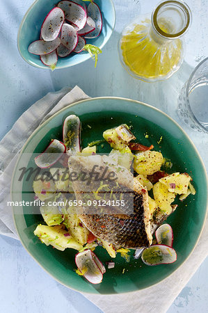 Branzini fillet on a potato and radish salad