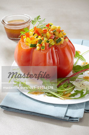 A beefsteak tomato filled with vegetables