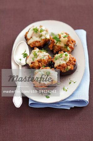 Baked portobello mushrooms stuffed with meat and cheese