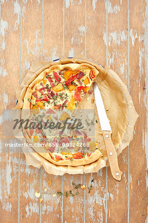 A quiche with pumpkin and peppers