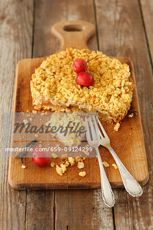 Apple crumble cake on a wooden board