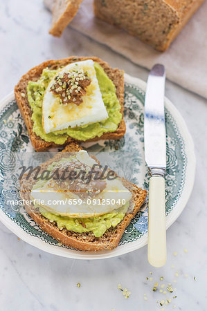 Toast with avocado cream and fried eggs