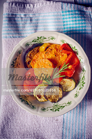 Roasted sweet potatoes and vegetables on a plate