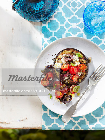 Aubergine with tomato, goat's cheese and olives