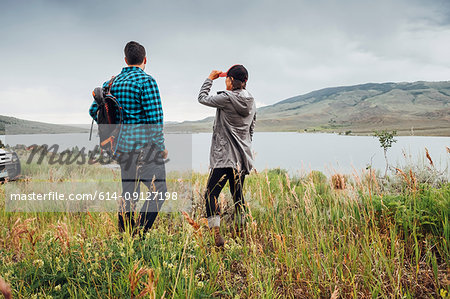 Couple near Dillon Reservoir, looking at view, Silverthorne, Colorado, USA