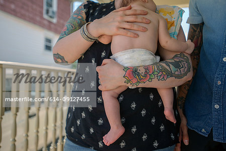 Woman with baby boy in arms