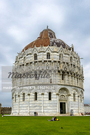 Tourists in front of baptistery, Miracles square. Europe, Italy, Tuscany, Pisa