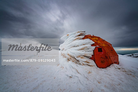 Bivacco Pelino covered with ice and the summit of Monte Amaro, Maiella, L'Aquila province, Abruzzo, Italy, Europe