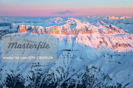 Enrosadira on the Sella group with Sass Pordoi and Piz Boè, aerial view, Dolomites, Alps, Belluno, Veneto, Italy