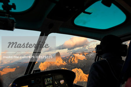 Interior of the cockpit of helicopter in flight on the Dolomites, South Tyrol, Italy