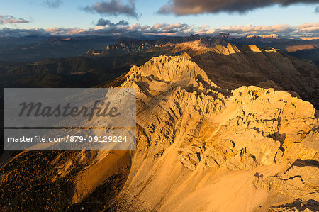 Aerial view of the rocky peaks of Latemar massif at sunset, Dolomites, South Tyrol, Italy