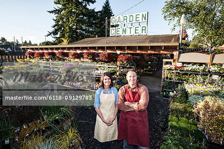 Caucasian man and woman garden centre nursery owners.