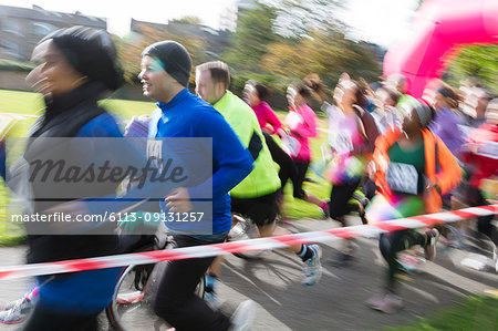 Runners running at charity run in park