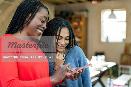 Mother and daughter using smart phone