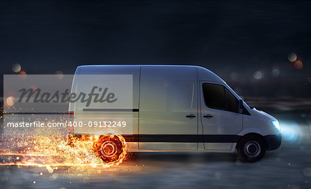 Super fast delivery of package service . van with wheels on fire on the road