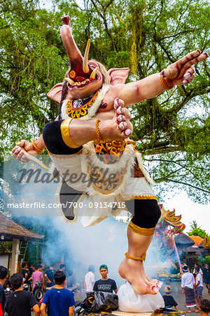 Ogoh-ogoh statue built for the Ngrupuk Parade, which takes place on the eve of Nyepi Day with crowds in the background in Ubud in Gianyar, Bali, Indonesia