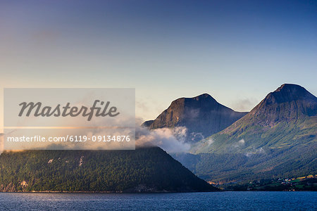 Low cloud catches the setting sun on Nordfjord (Northern Fjord), Norway, Scandinavia, Europe