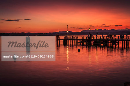 View of golden sunset on Lake Garda, Sirmione, Lake Garda, Lombardy, Italian Lakes, Italy, Europe