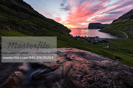 Water of creek flows on rocks, Tjornuvik, Sunda Municipality, Streymoy Island, Faroe Islands, Denmark, Europe