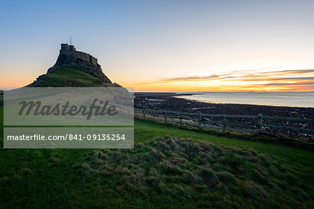 Lindisfarne Castle at sunrise, Holy Island, Northumberland, England, United Kingdom, Europe Lindisfarne Castle at sunrise, Holy Island, Northumberland, England, United Kingdom, Europe