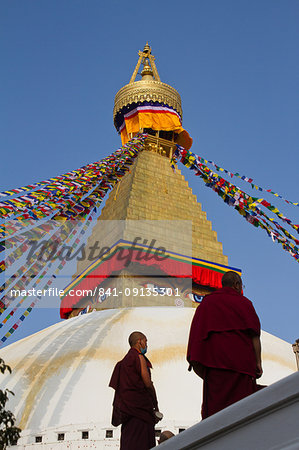 Tibetan Buddhist monks and Boudhanath Stupa, UNESCO World Heritage Site, Kathmandu, Nepal, Asia