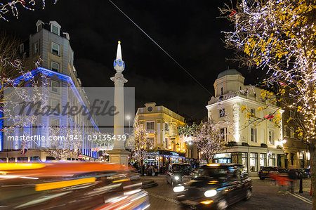 View of traffic at Seven Dials at night, London, England, United Kingdom, Europe