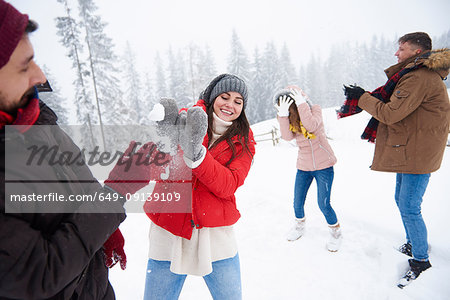 Friends playing in snow