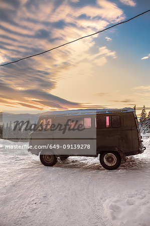 Camper van on covered landscape at sunset, Gurne, Ukraine, Eastern Europe