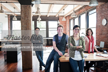 Team of mixed race workers in a creative office.