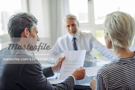 Businessman meeting with couple