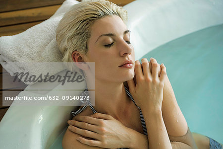 Woman soaking in tub