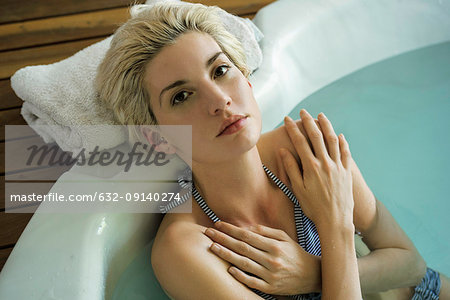 Woman soaking in tub