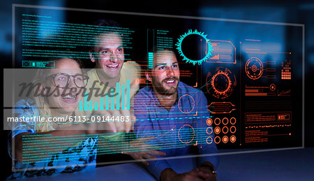 Enthusiastic business people using futuristic hologram computer