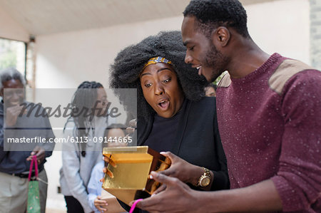 Brother surprising sister with Christmas gift