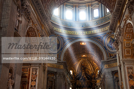 Low angle view of ceiling of the dome of St Peter's Basilica Church, Vatican City, Rome, Italy.