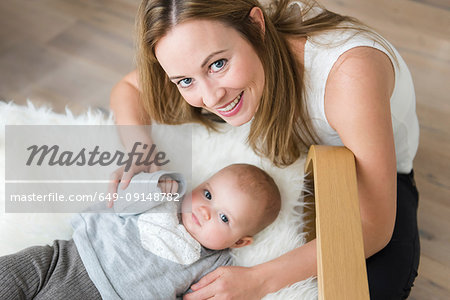 Mother with baby on chair