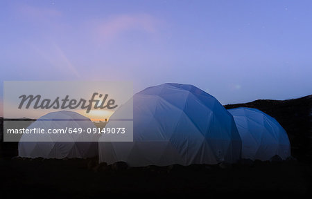 Three white dome tents at sunset, Narsaq, Vestgronland, South Greenland