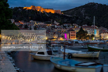 The port of Hvar Town and the Spanish Fortress at dusk, Hvar, Croatia, Europe