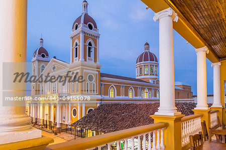 The Cathedral of Granada seen from the balcony of a bar at dusk, Granada, Nicaragua, Central America