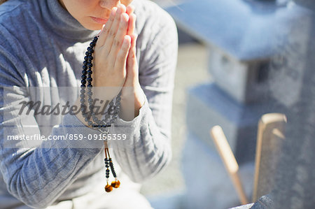 Japanese woman at a cemetery