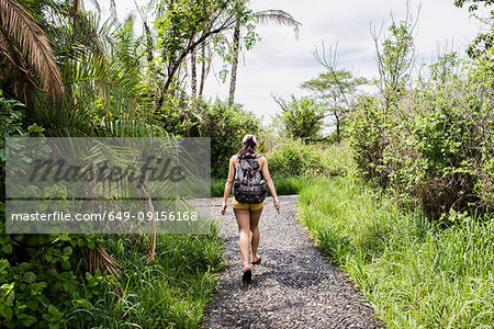 Young female tourist walking path near Victoria Falls, Zimbabwe, Africa