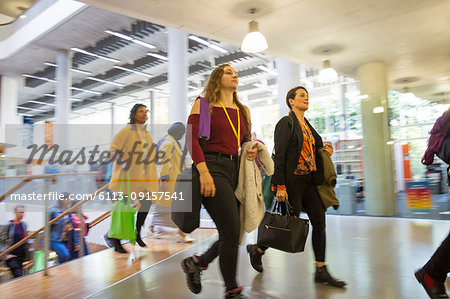 Businesswomen walking, arriving in office