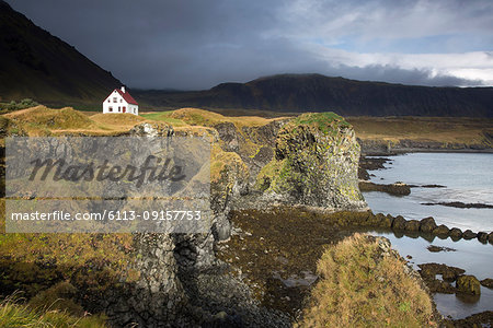 Remote house on craggy, remote cliff, Arnarstapi, Snaefellsnes, Iceland